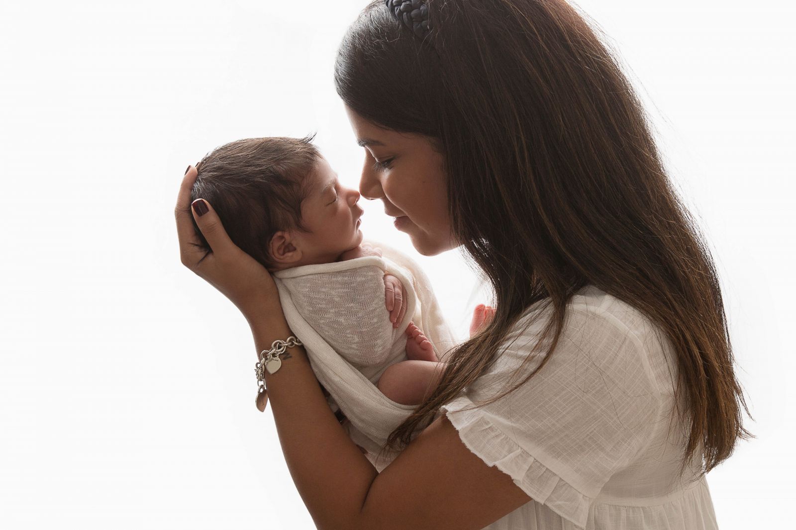 newborn photography - mother holding baby