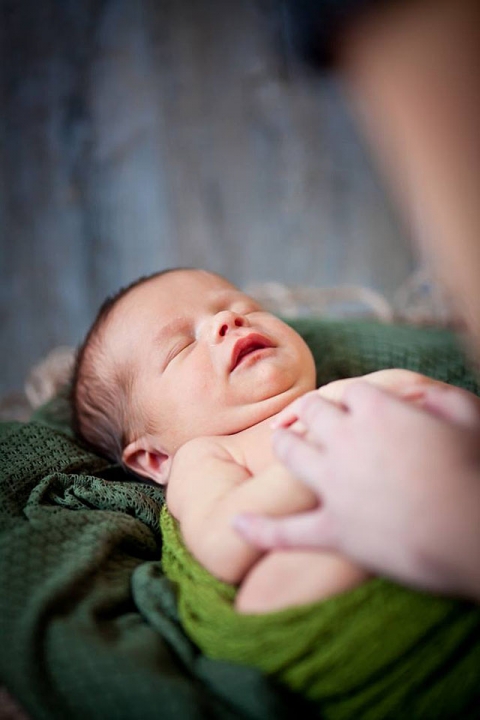 Newborn Photography Backstage - baby posed by photographer