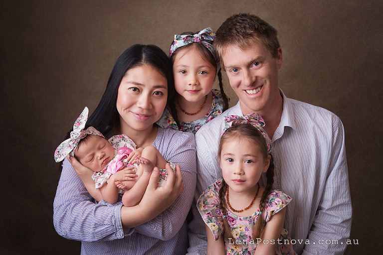 newborn baby girl with two older siblings and parents family portrait