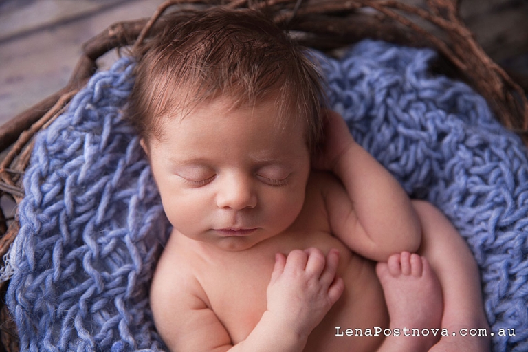 Newborn baby boy sleeping in the vintage prop