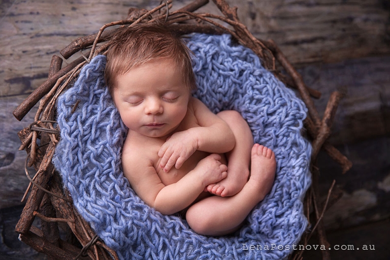 newborn photo shoot - baby boy sleeping in the vintage prop