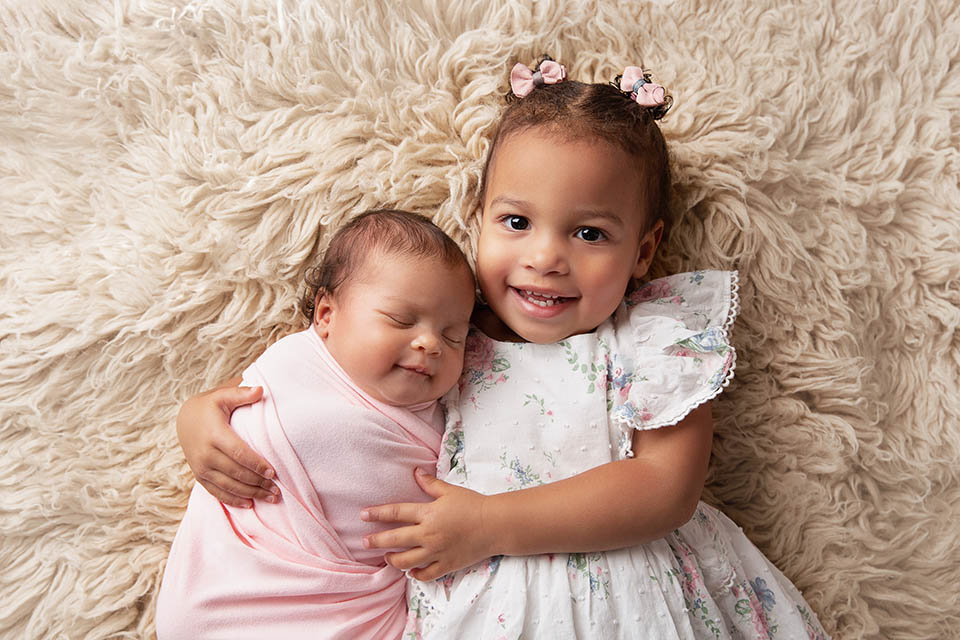 newborn with the toddler Sydney