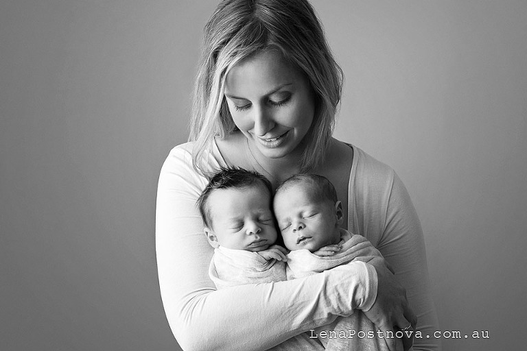 Sydney twins photography - mother holding 2 newborn babies