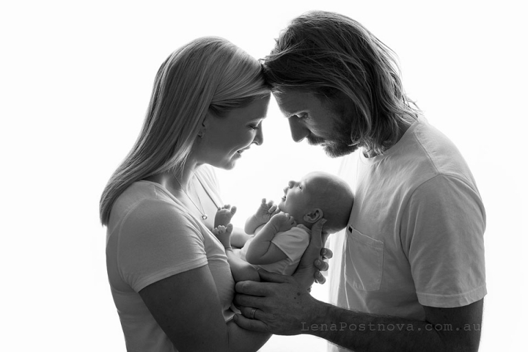 parents looking at their baby - Older Newborn Photos