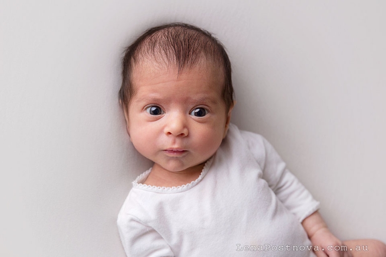 newborn baby girl 5 weeks old awake portrait