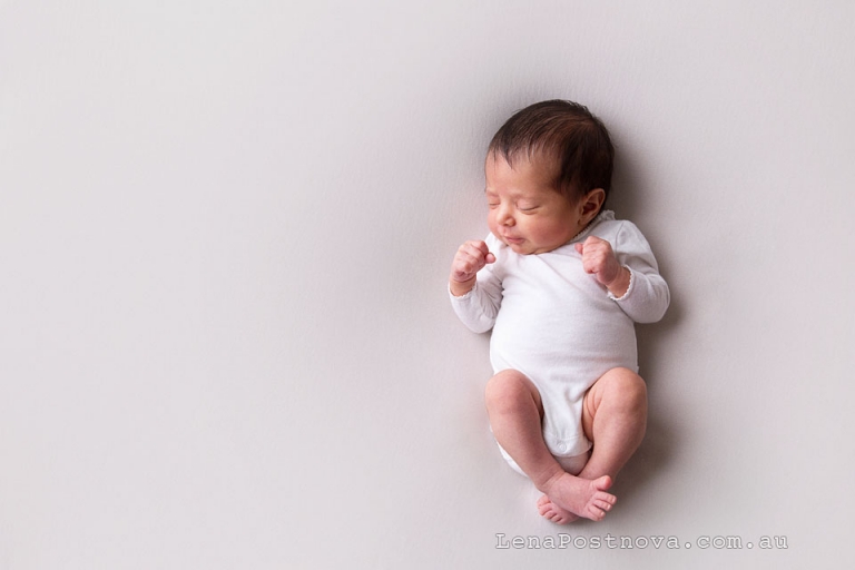 newborn baby girl 5 weeks old sleepy portrait