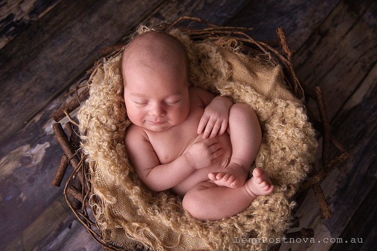 Newborn photography older baby - newborn sleeping in the prop