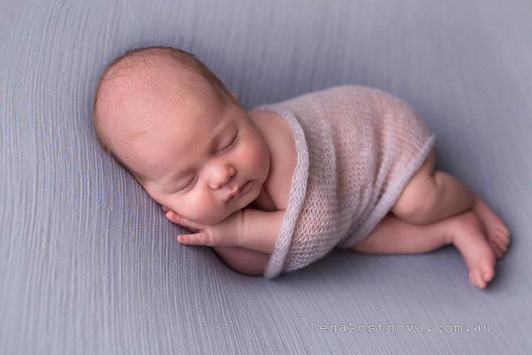 1 months old baby posed on the side