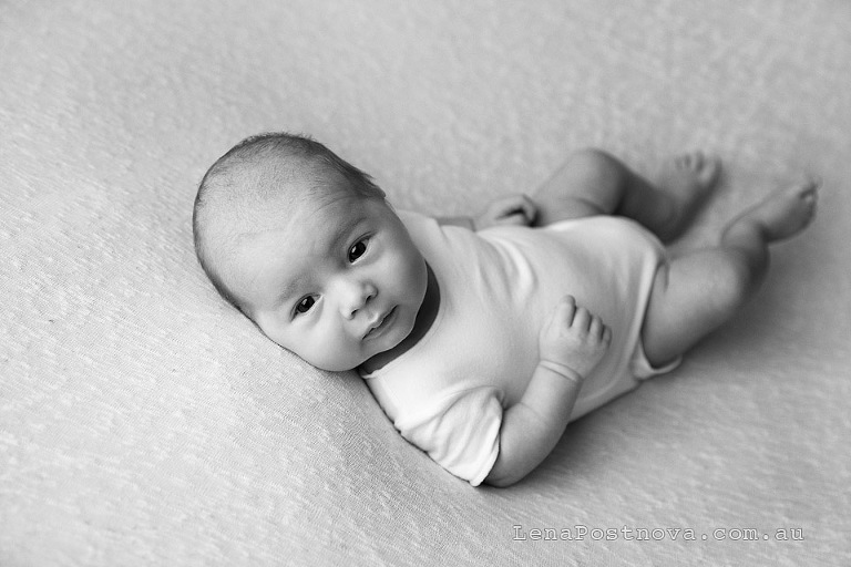 Newborn photography older baby Sydney - one monthe old baby boy wearing white romper