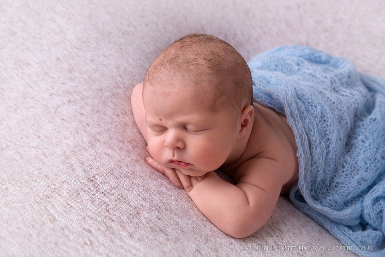 newborn baby boy on his tummy