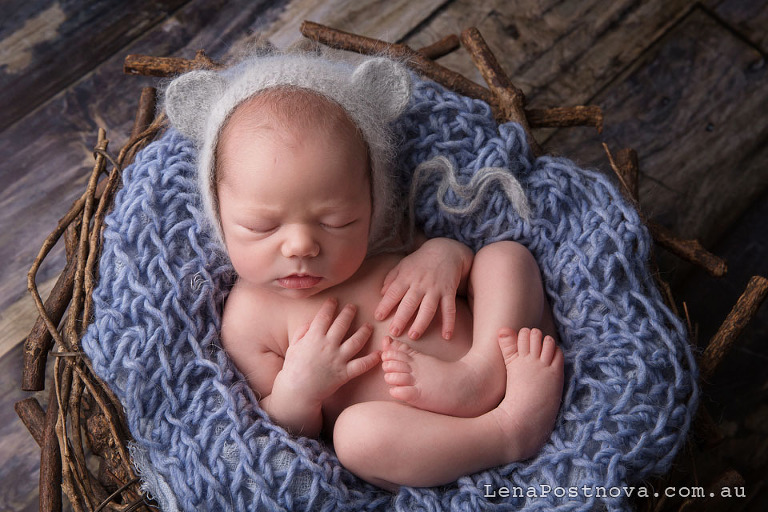 newborn wearing a cute knit hat