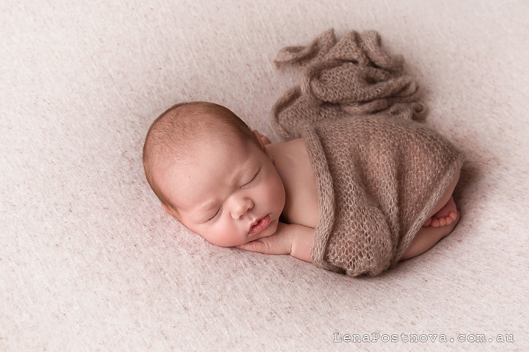 Newborn baby sleeping on the tummy