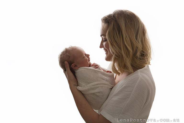 Baby smiling to his mother at Newborn Photography Northern Beaches of Sydney photo shoot.