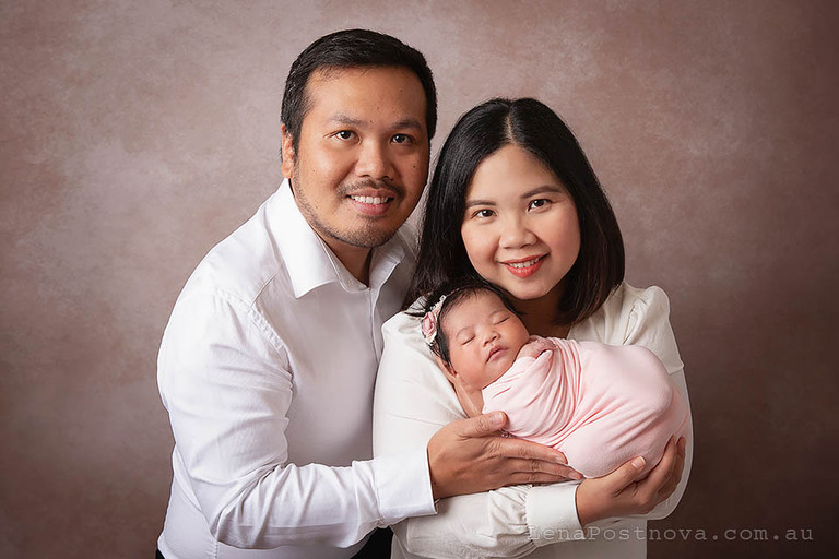 studio style parents with newborn portrait captured at home newborn photography Sydney session