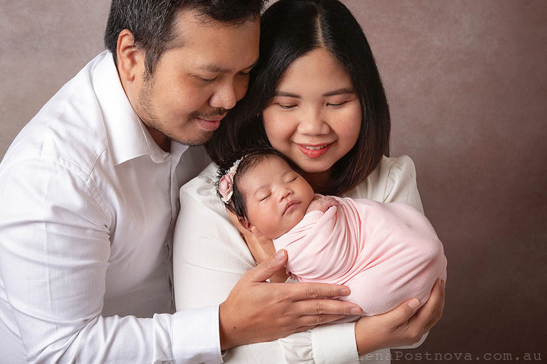 newborn photography portrait of mum and dad with newborn baby girl