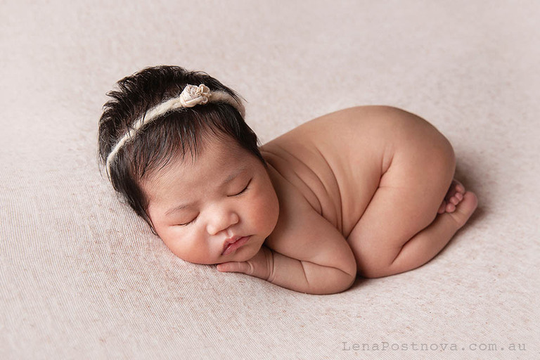 studio style posed newborn portrait captured at home newborn photography session