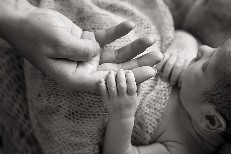 newborn baby holding mother's hand - Professional Baby Photos Sydney