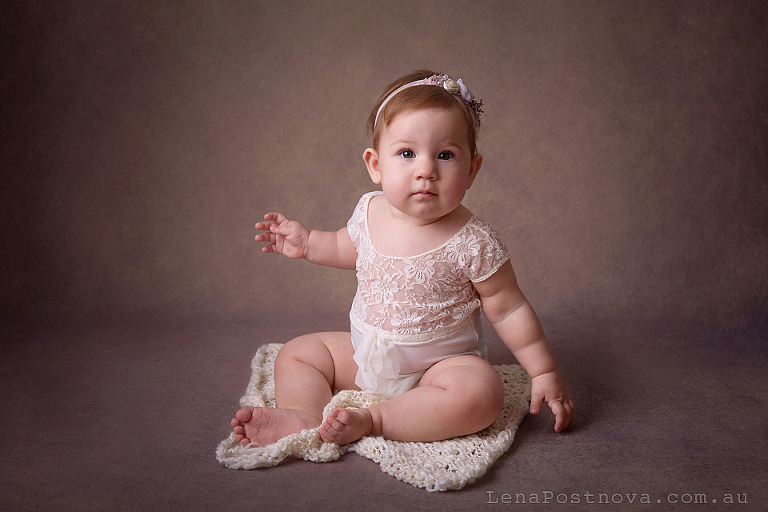 baby girl 8 months old sitting