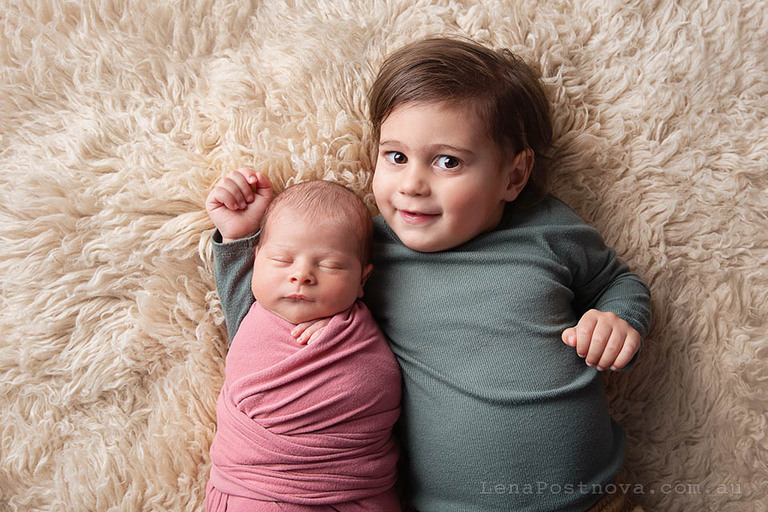 sibling with newborn captured by Mobile newborn photographer 