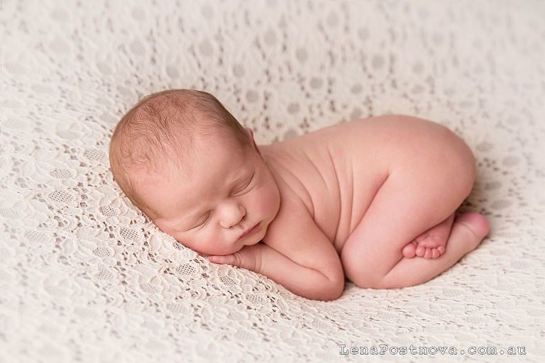 newborn baby in bum up pose 