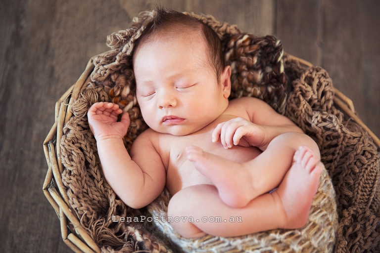 Baby capruted by Newborn Baby Photographer