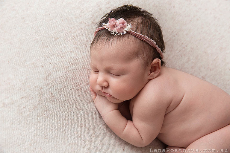 newborn baby with the pink bow 