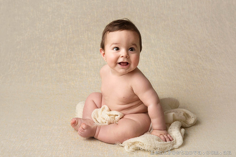 adorable chubby 6 months old baby smiling 