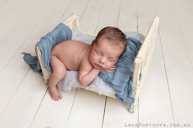 baby sleeping in the tiny bed