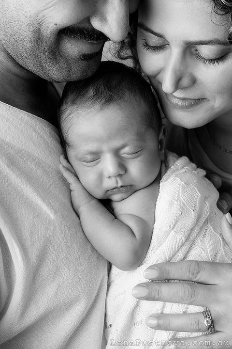 Family portrait captured at home. The beginning of a beautiful journey together.